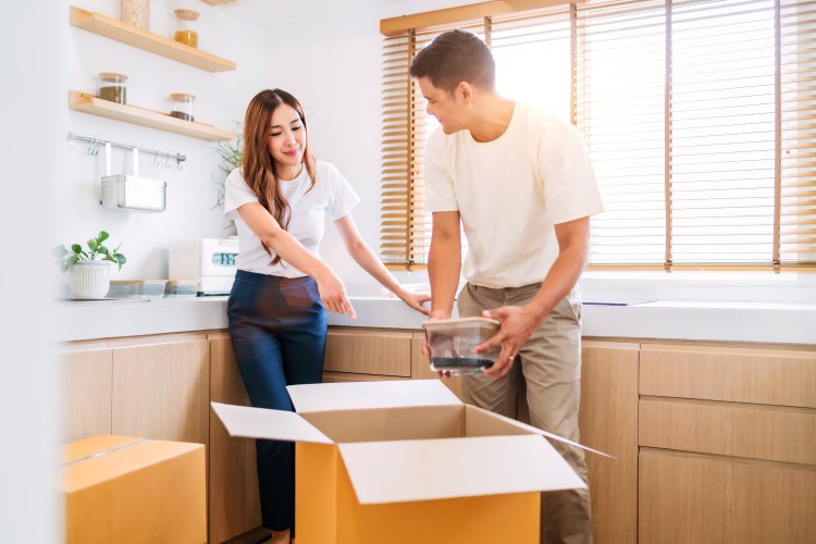 Couple preparing house for movers