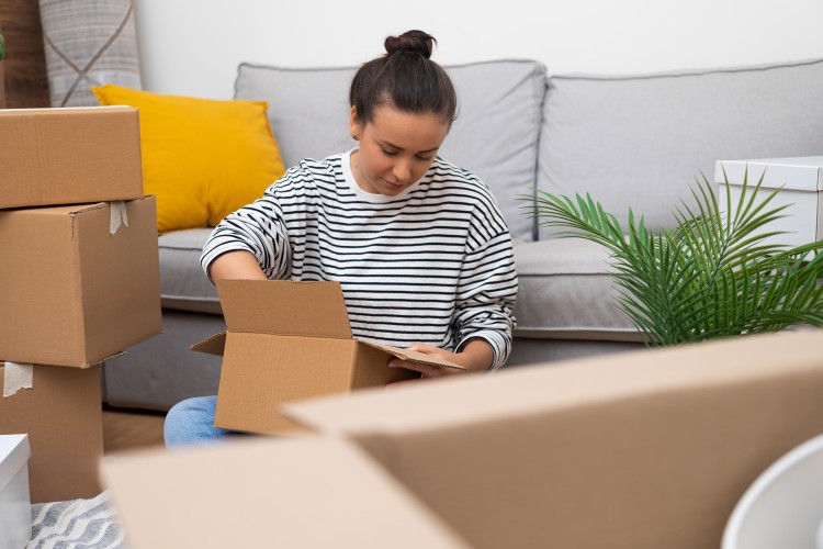 Women packing for house movers