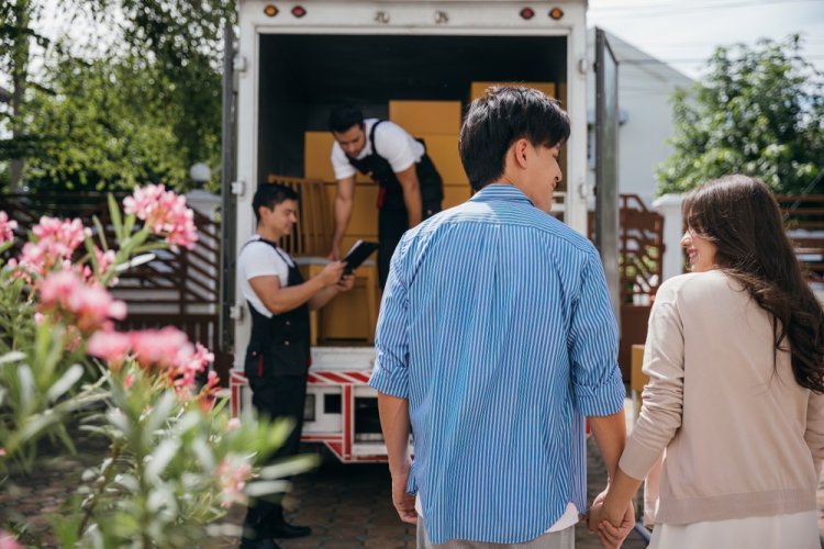 Happy couple after movers completing their job